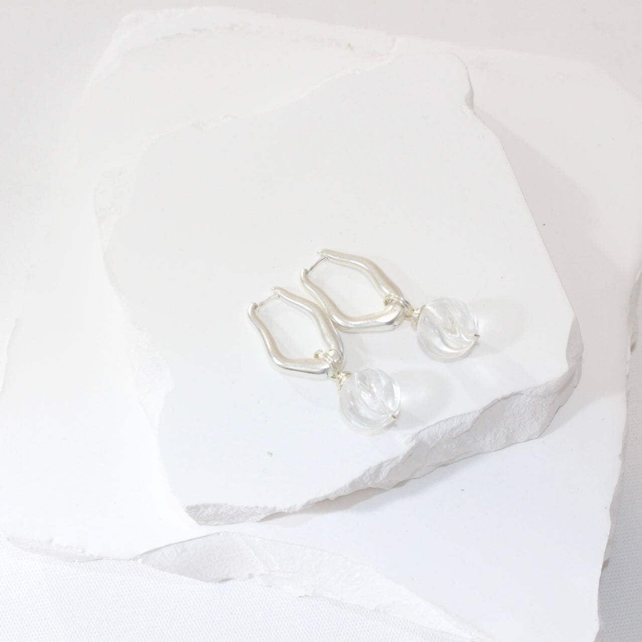 Clear quartz crystal hoop earrings Silver With 932 Sterling Silver Hoops. Free express shipping. Shop online at ASH&STONE crystal shop Auckland NZ.