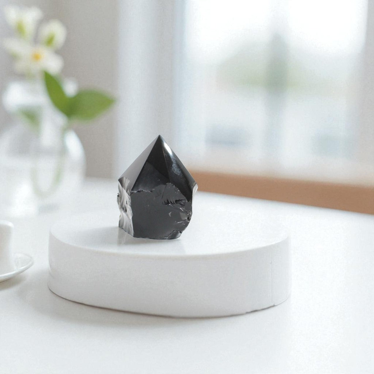 Black Obsidian Polished Point Crystal. Get the protection you need. Free express shipping. Shop online from ASH&STONE crystal shop Auckland NZ. AfterPay available.