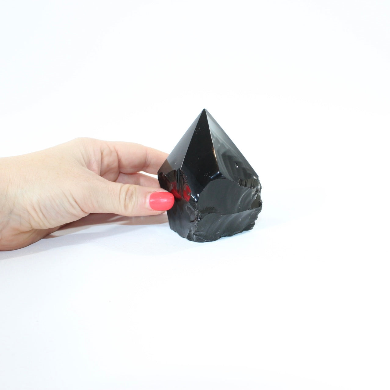Black Obsidian Polished Point Crystal. Get the protection you need. Free express shipping. Shop online from ASH&STONE crystal shop Auckland NZ. AfterPay available.