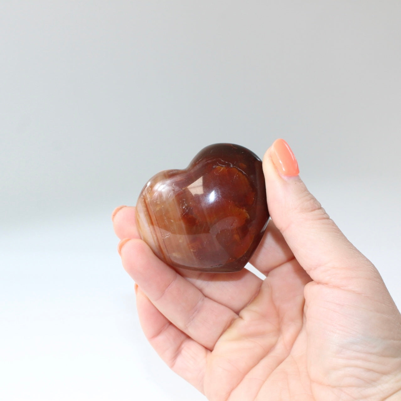 Carnelian deep red polished crystal heart. Free express shipping. Shop online from ASH&STONE crystal shop Auckland NZ. AfterPay available.