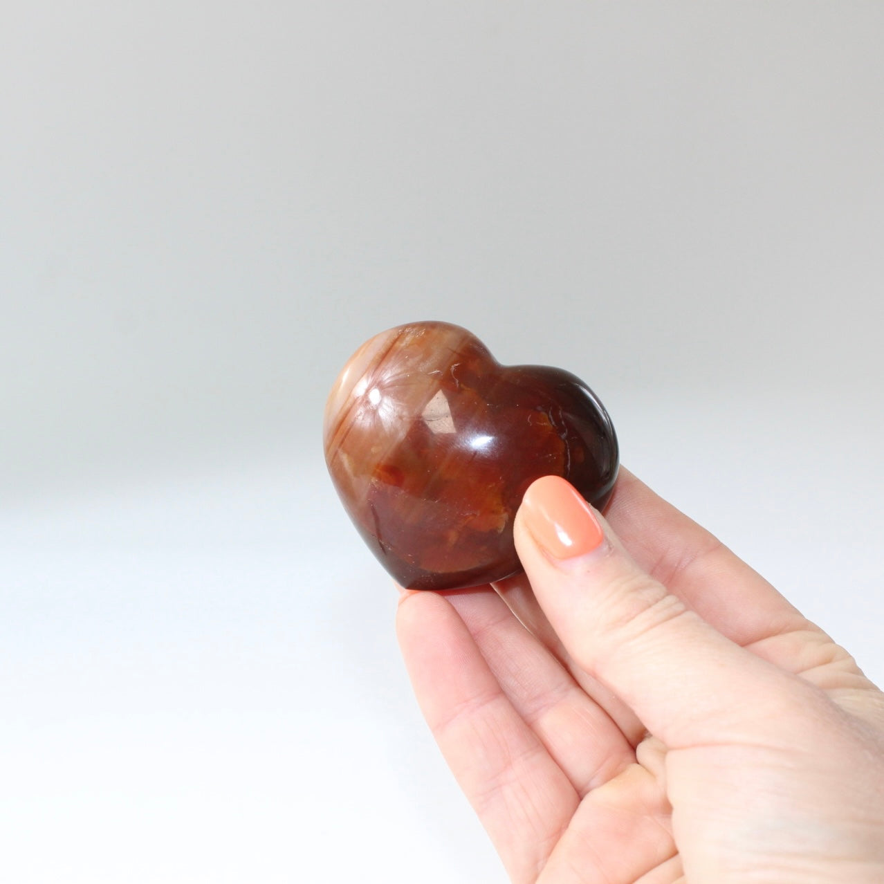 Carnelian deep red polished crystal heart. Free express shipping. Shop online from ASH&STONE crystal shop Auckland NZ. AfterPay available.