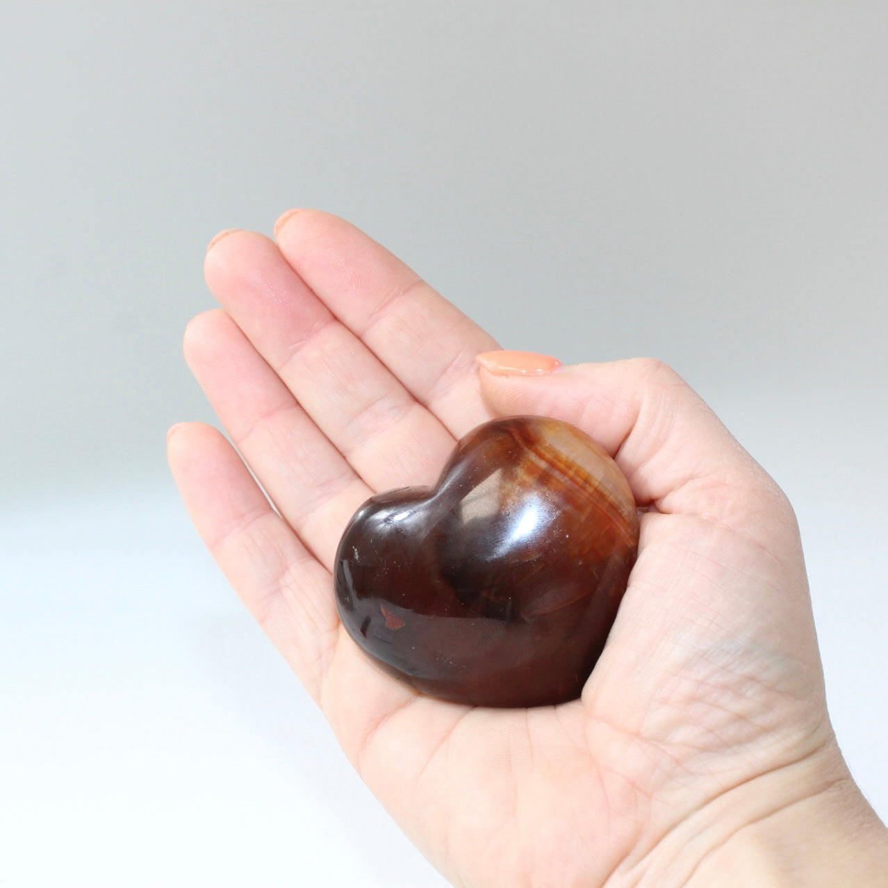 Carnelian deep red polished crystal heart. Free express shipping. Shop online from ASH&STONE crystal shop Auckland NZ. AfterPay available.