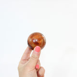 Carnelian Polished Sphere | ASH & STONE, Premium crystals online. Free express shipping. 