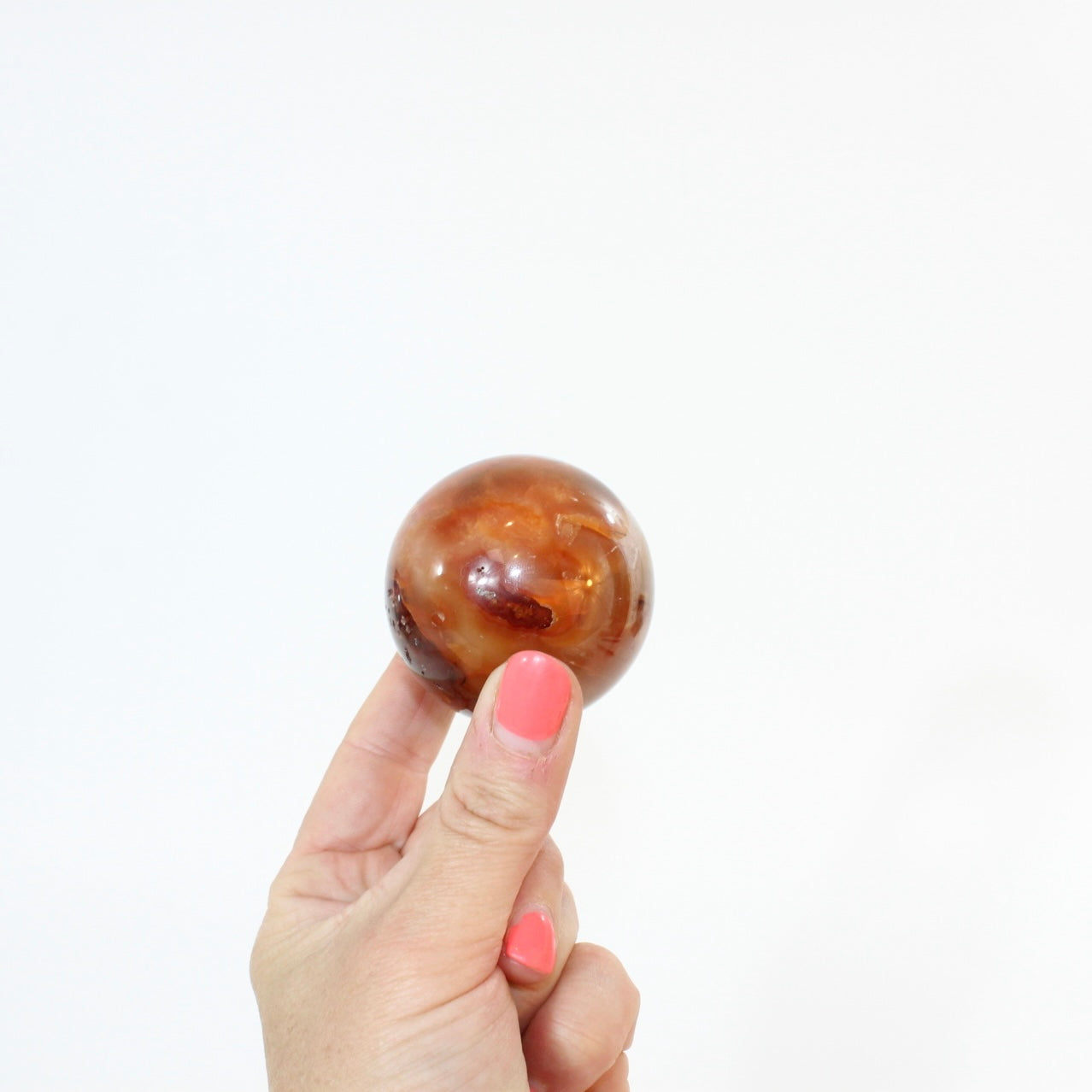Carnelian Polished Sphere | ASH & STONE, Premium crystals online. Free express shipping. 