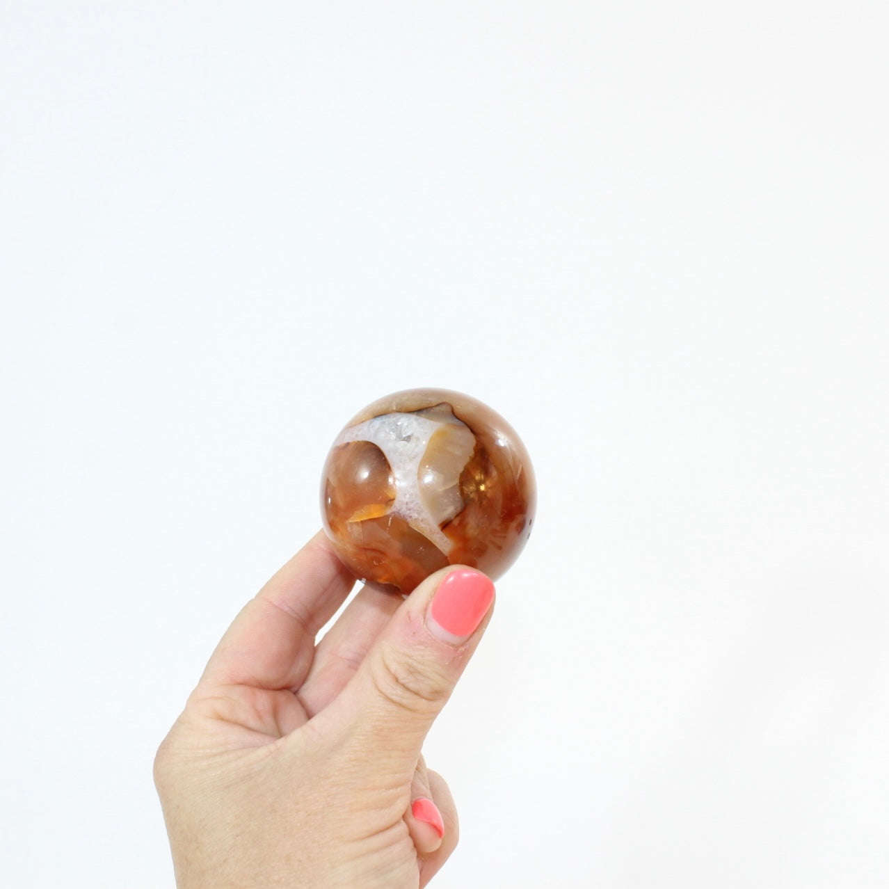 Carnelian Polished Sphere | ASH & STONE, Premium crystals online. Free express shipping. 