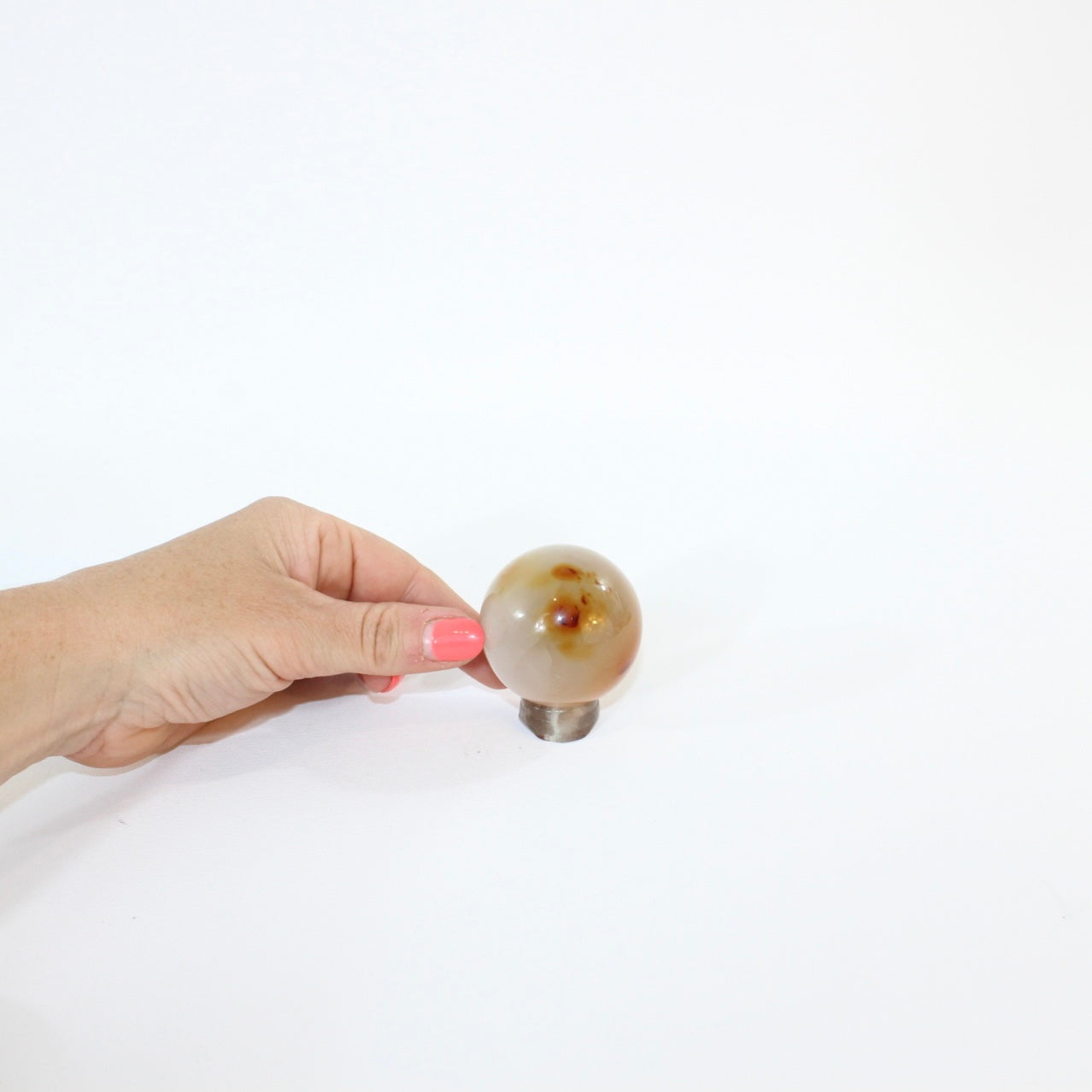 Carnelian Polished Crystal Sphere on stand | ASH&STONE, premium crystals online. Free express shippingin NZ 