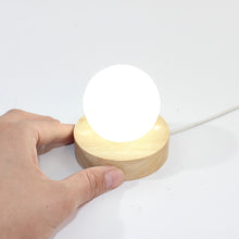 Load image into Gallery viewer, Clear quartz crystal sphere on LED lamp base | ASH&amp;STONE Crystal Shop Auckland NZ
