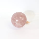 Rose quartz crystal polished sphere with clear quartz crystal stand 1.03kg | ASH&STONE Crystals Shop Auckland NZ