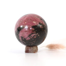 Load image into Gallery viewer, Rhodonite polished crystal sphere on agate stand | ASH&amp;STONE Crystals Shop Auckland NZ
