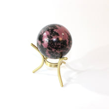 Load image into Gallery viewer, Rhodonite polished crystal sphere with stand | ASH&amp;STONE Crystals Shop Auckland NZ
