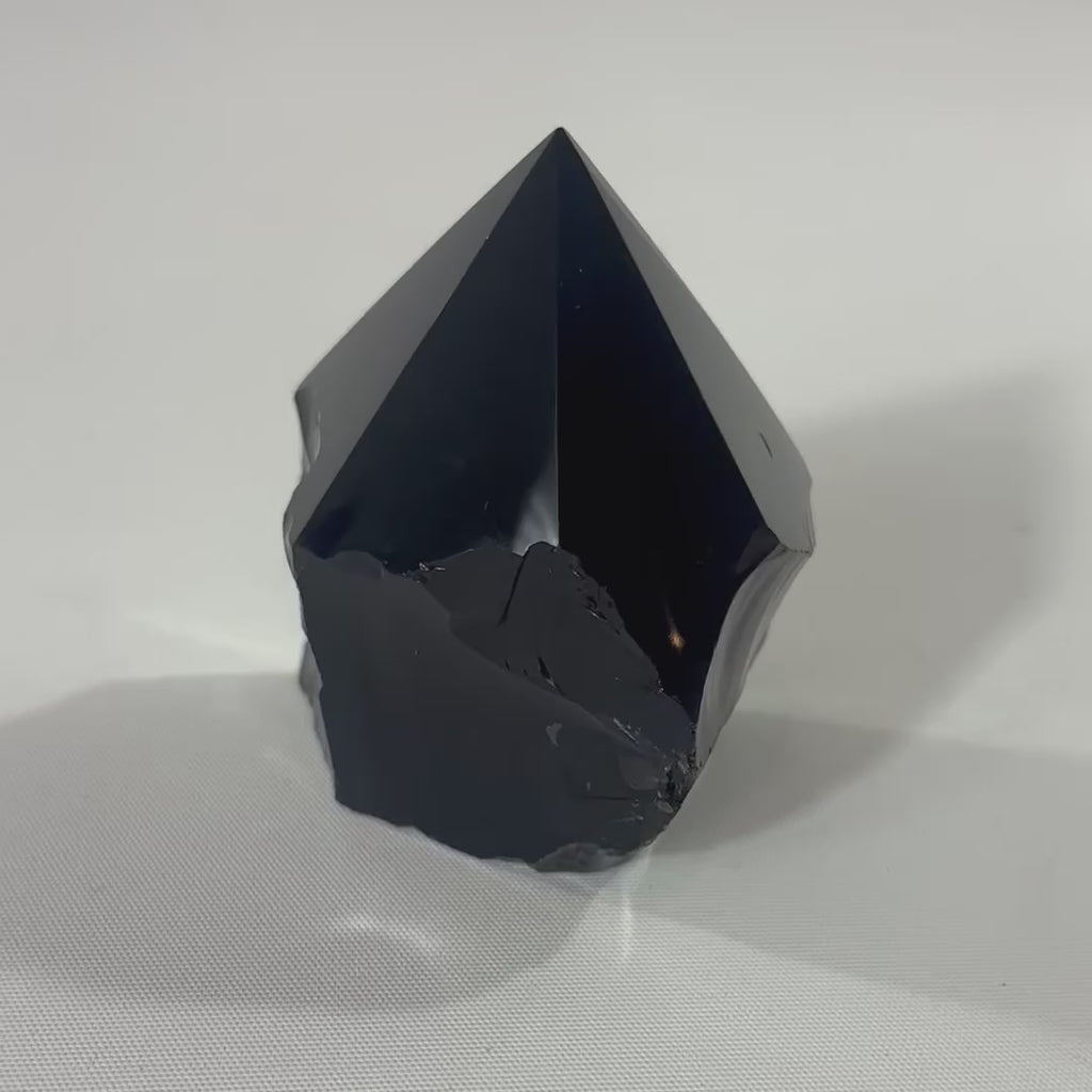 Black Obsidian Polished Point Crystal. Get the protection you need. Free express shipping. Shop online from ASH&STONE crystal shop Auckland NZ. AfterPay available.