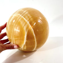 Load and play video in Gallery viewer, Large orange calcite crystal sphere 11.4kg | ASH&amp;STONE Crystal Shop Auckland NZ
