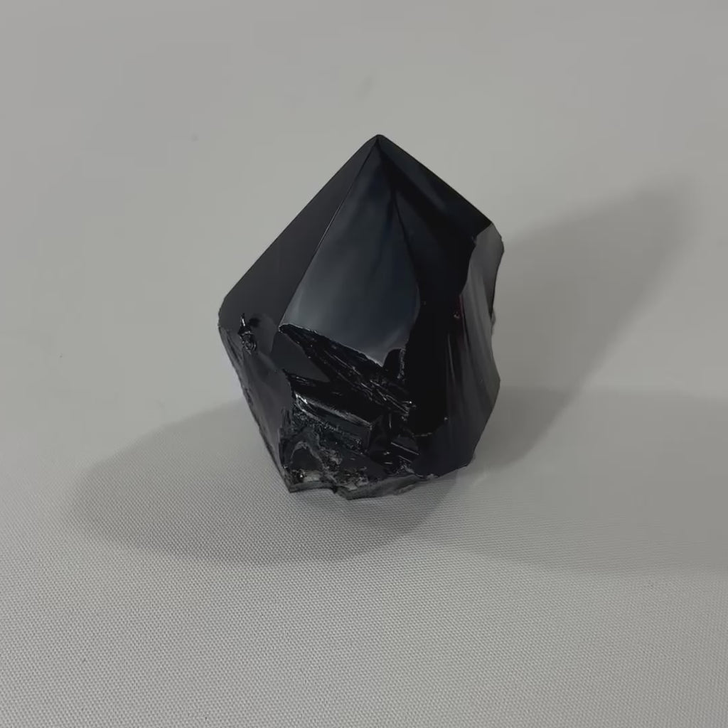 Black Obsidian Polished Point Crystal. Get the protection you need. Free express shipping. Shop online from ASH&STONE crystal shop Auckland NZ. AfterPay available.
