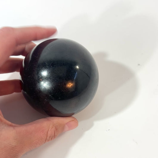 Black tourmaline polished crystal sphere | ASH&STONE Crystals Shop Auckland NZ