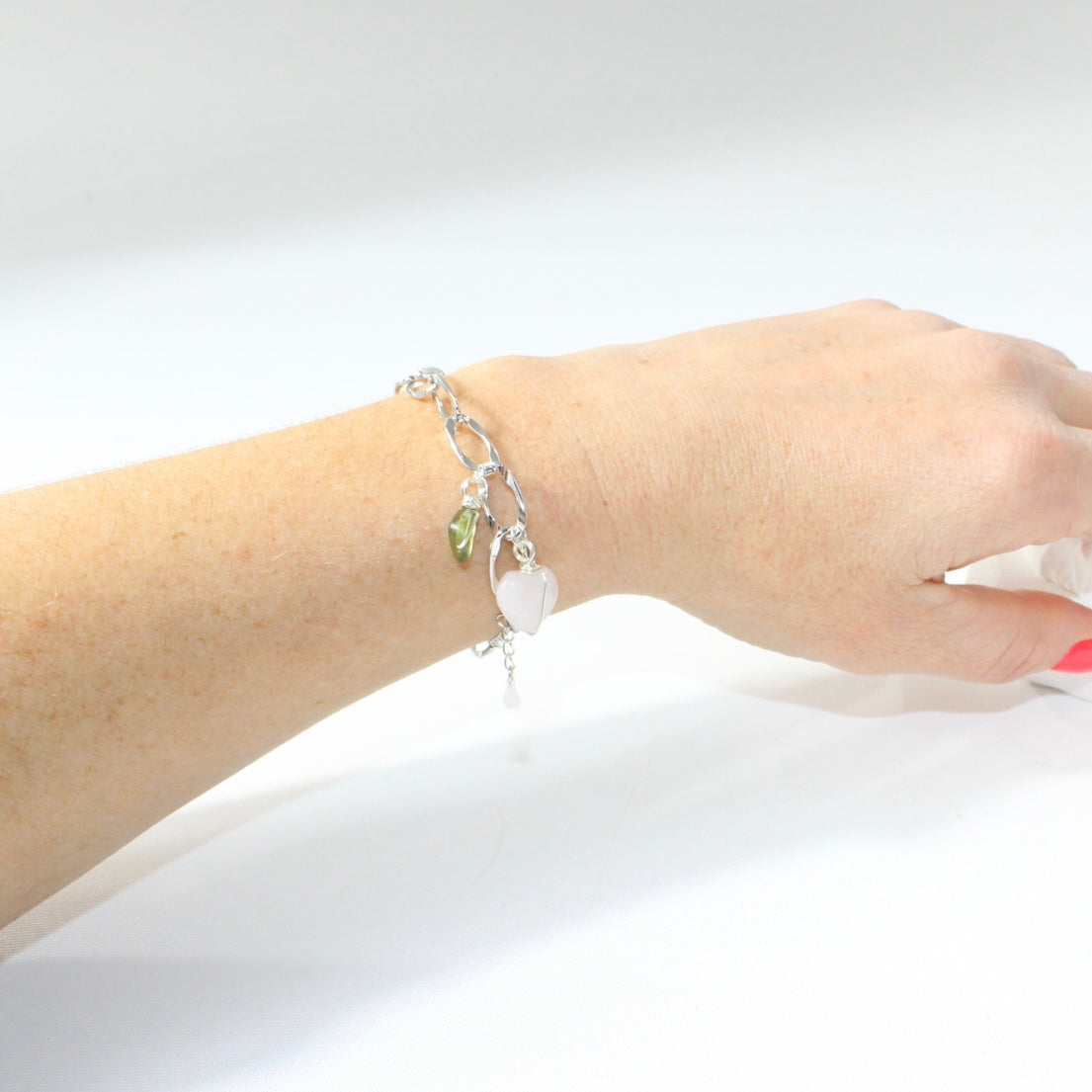 Rose Quartz & Peridot crystal sterling silver charm bracelet. Free express shipping. Shop online from ASH&STONE crystal jewellery shop Auckland NZ. 