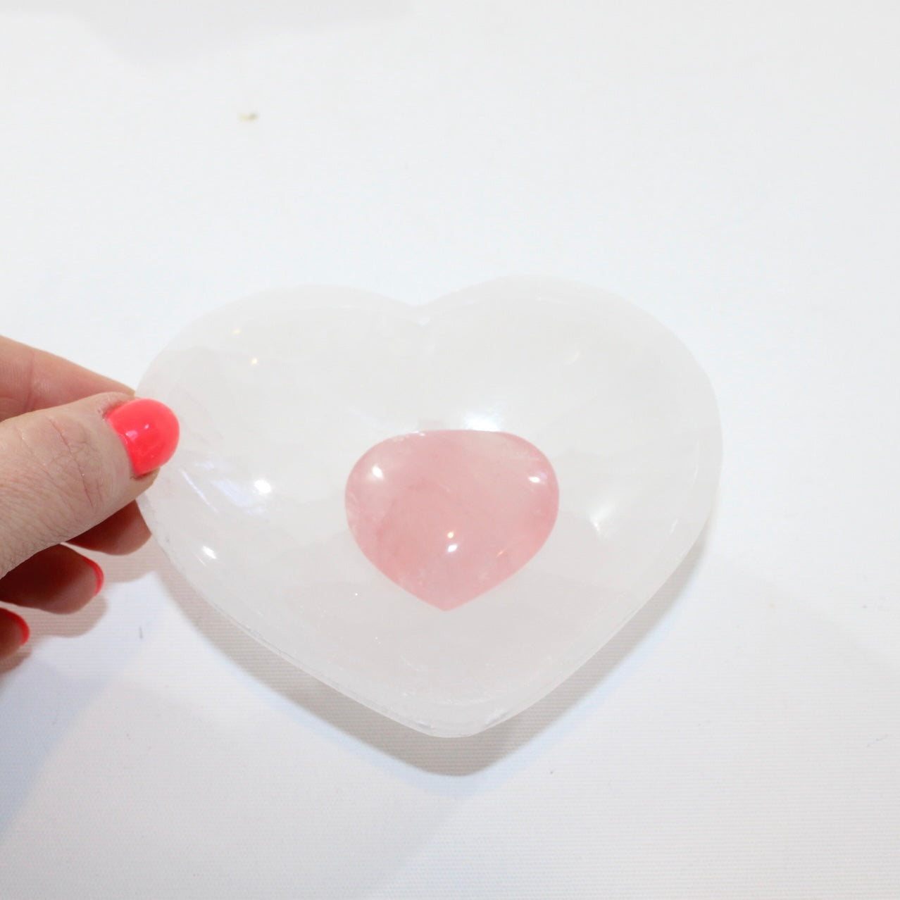  Selenite Crystal Heart Bowl matched with a Rose Quartz crystal heart mini.  Free express shipping. Shop online from ASH&STONE crystal shop Auckland NZ. AfterPay available.