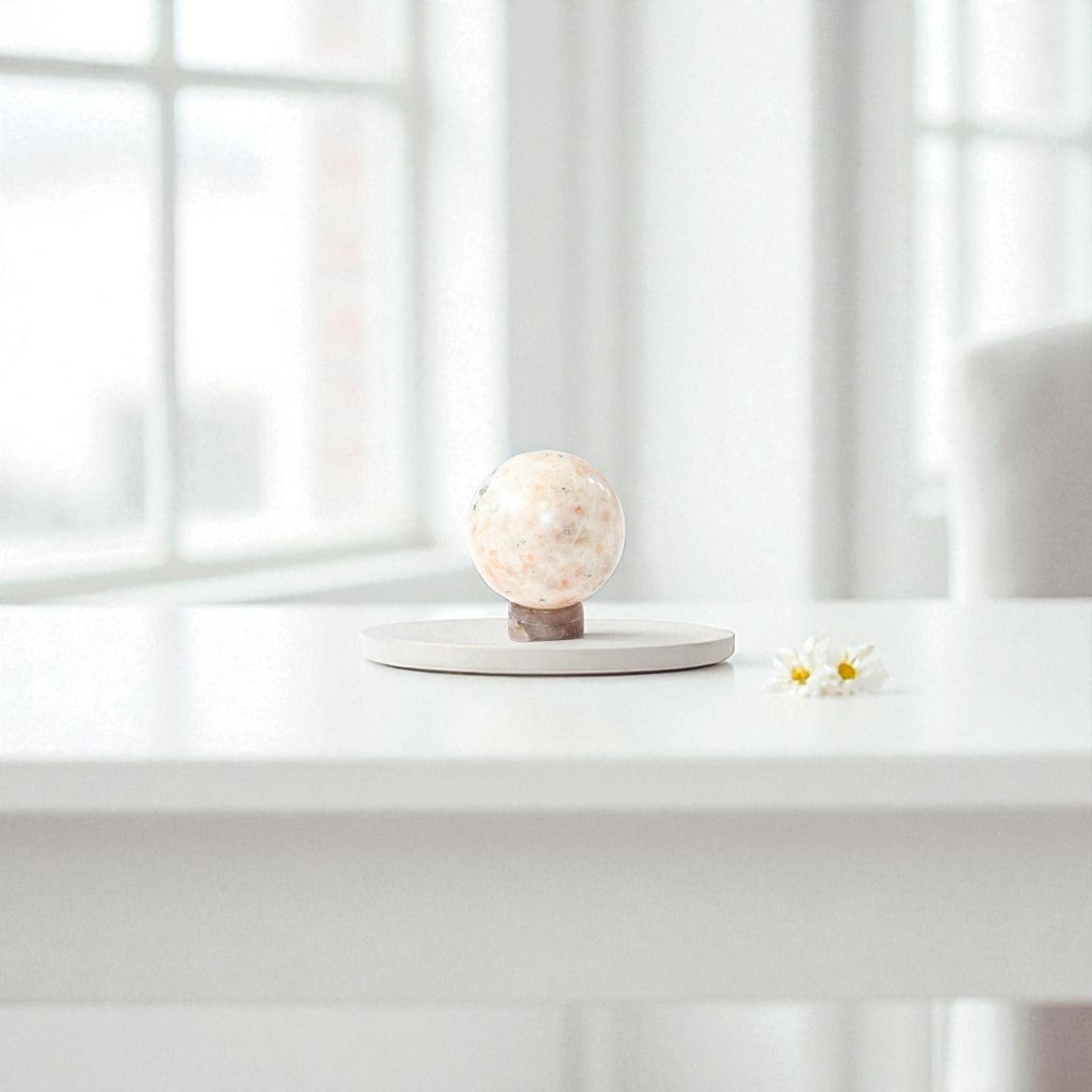 Sunstone Polished Crystal Sphere on a Small Quartz Crystal Stand. Free express shipping. Shop online from ASH&STONE crystal shop Auckland NZ. AfterPay available.
