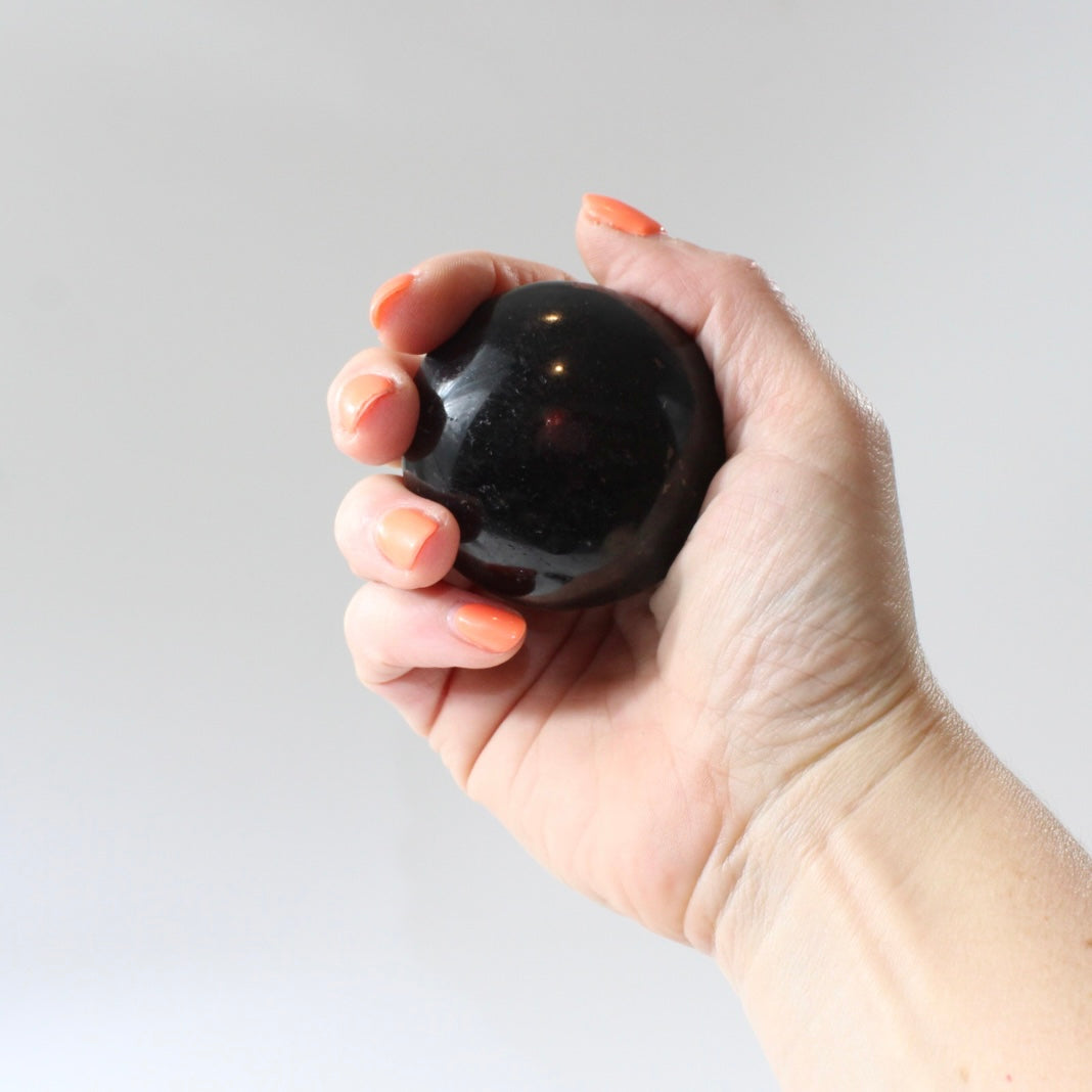 Black Tourmaline Palm Stone | Free express shipping. Buy high quality ethical crystals online at ASH&STONE crystal shop Auckland NZ. AfterPay available.