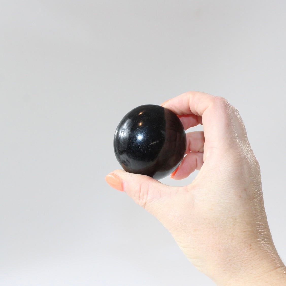 Black Tourmaline Palm Stone | Free express shipping. Buy high quality ethical crystals online at ASH&STONE crystal shop Auckland NZ. AfterPay available.