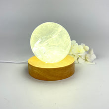 Load image into Gallery viewer, Crystal lamps NZ: Clear quartz polished crystal sphere on LED lamp base
