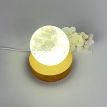 Load image into Gallery viewer, Crystal lamps NZ: Clear quartz polished crystal sphere on LED lamp base
