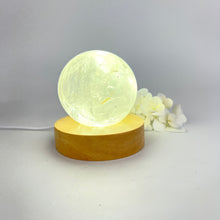 Load image into Gallery viewer, Crystal lamps NZ: Clear quartz polished crystal sphere on LED lamp base
