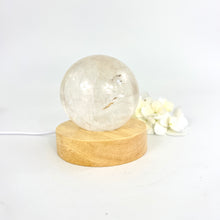 Load image into Gallery viewer, Crystal lamps NZ: Clear quartz polished crystal sphere on LED lamp base
