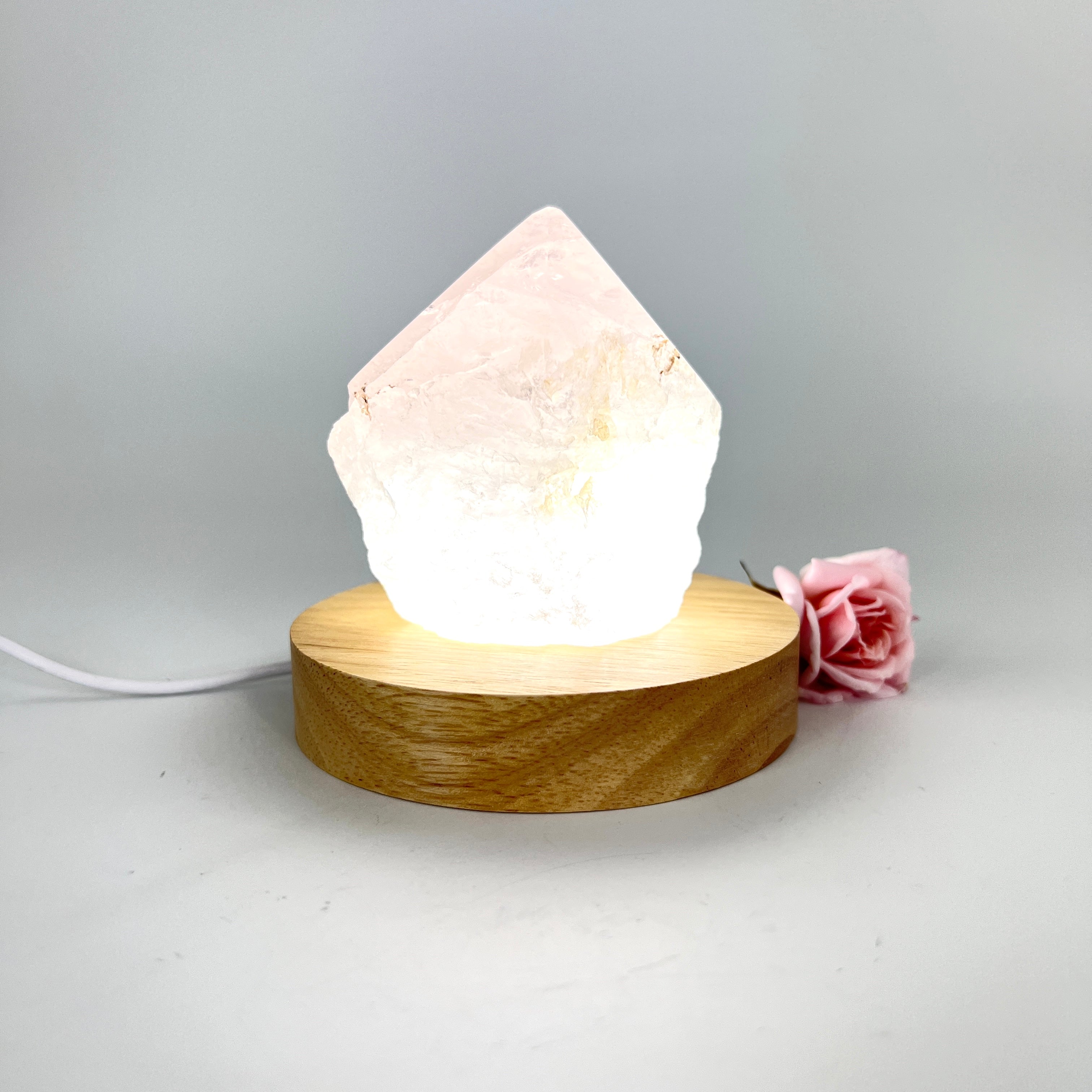Crystal Lamps NZ: Rose quartz crystal lamp on LED wooden base