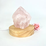 Crystal Lamps NZ: Rose quartz crystal lamp on LED wooden base