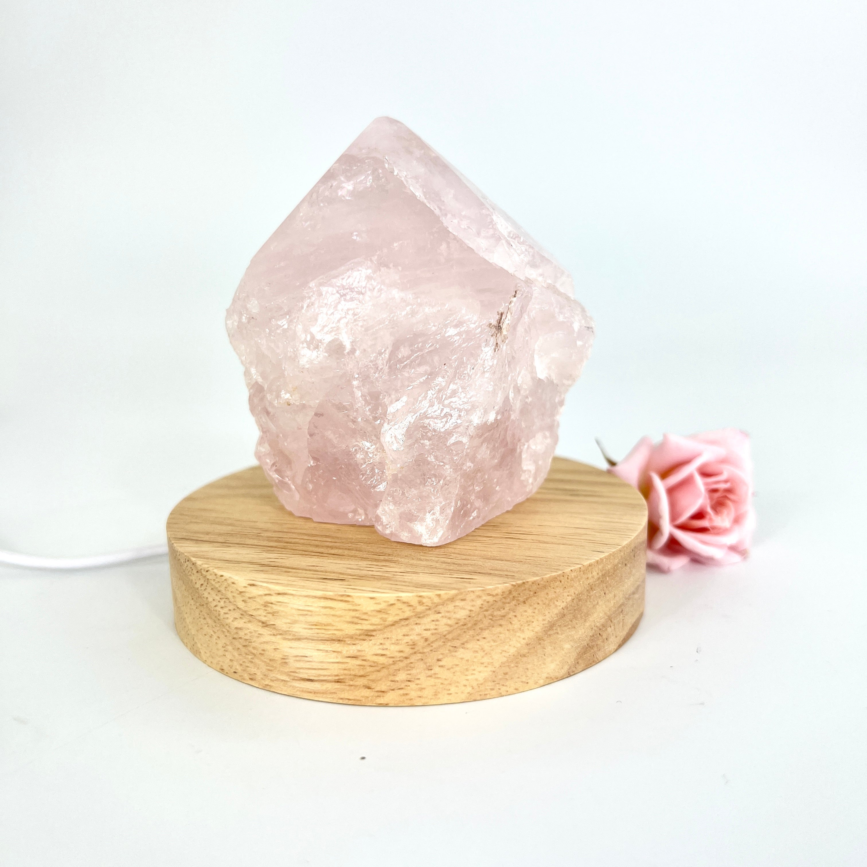 Crystal Lamps NZ: Rose quartz crystal lamp on LED wooden base