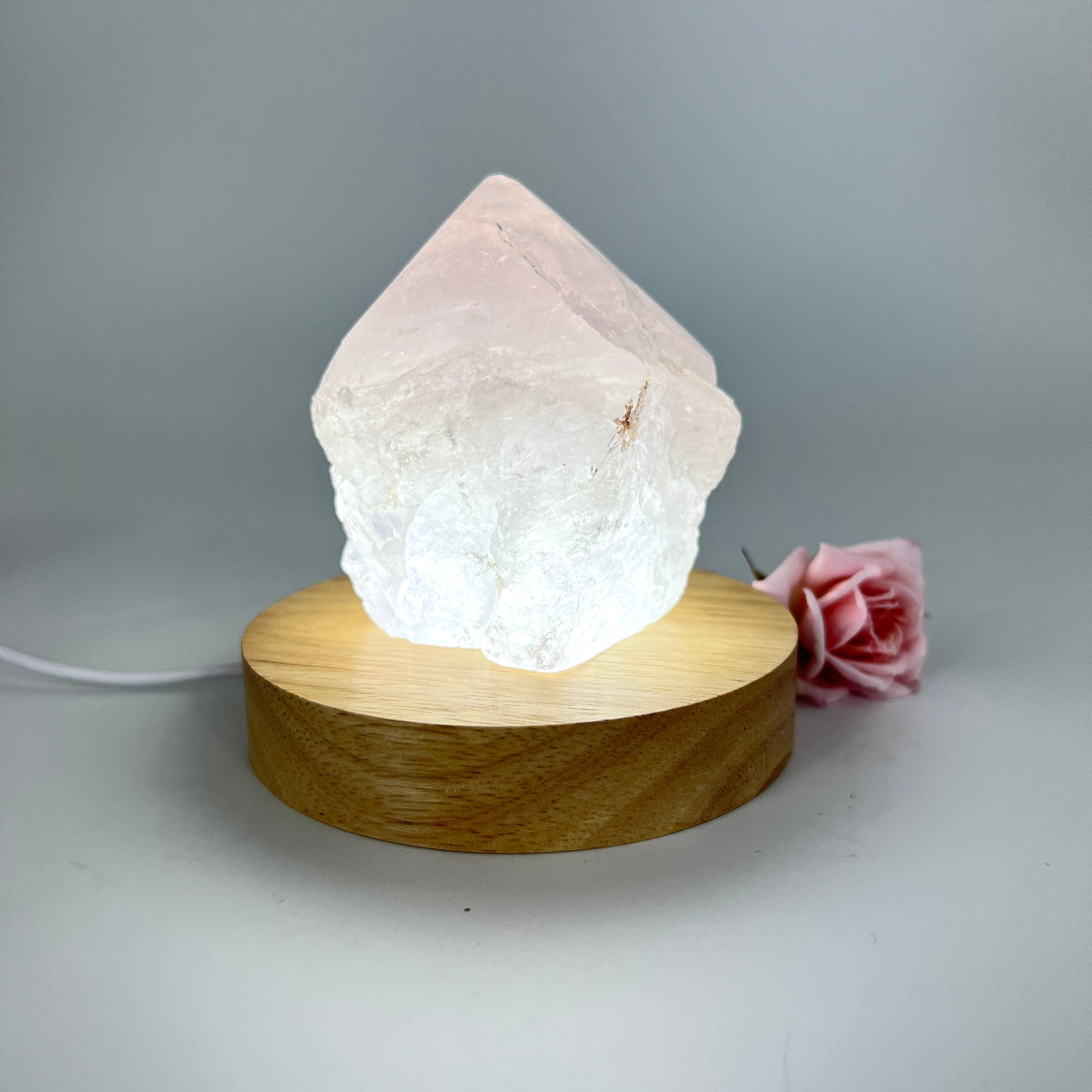Crystal Lamps NZ: Rose quartz crystal lamp on LED wooden base