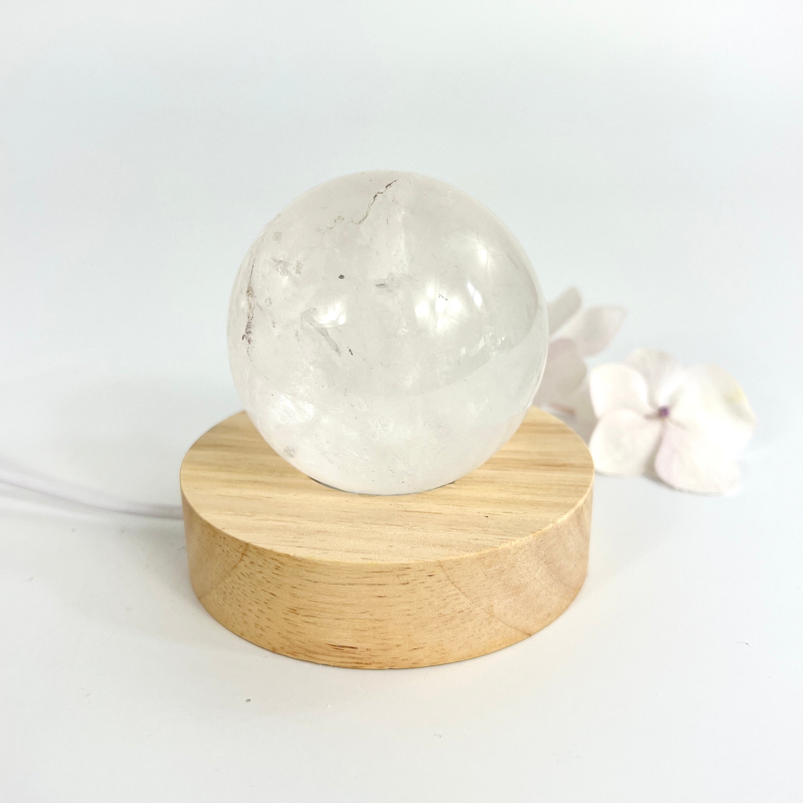 Crystal Lamps NZ: Clear quartz polished crystal sphere on LED lamp base