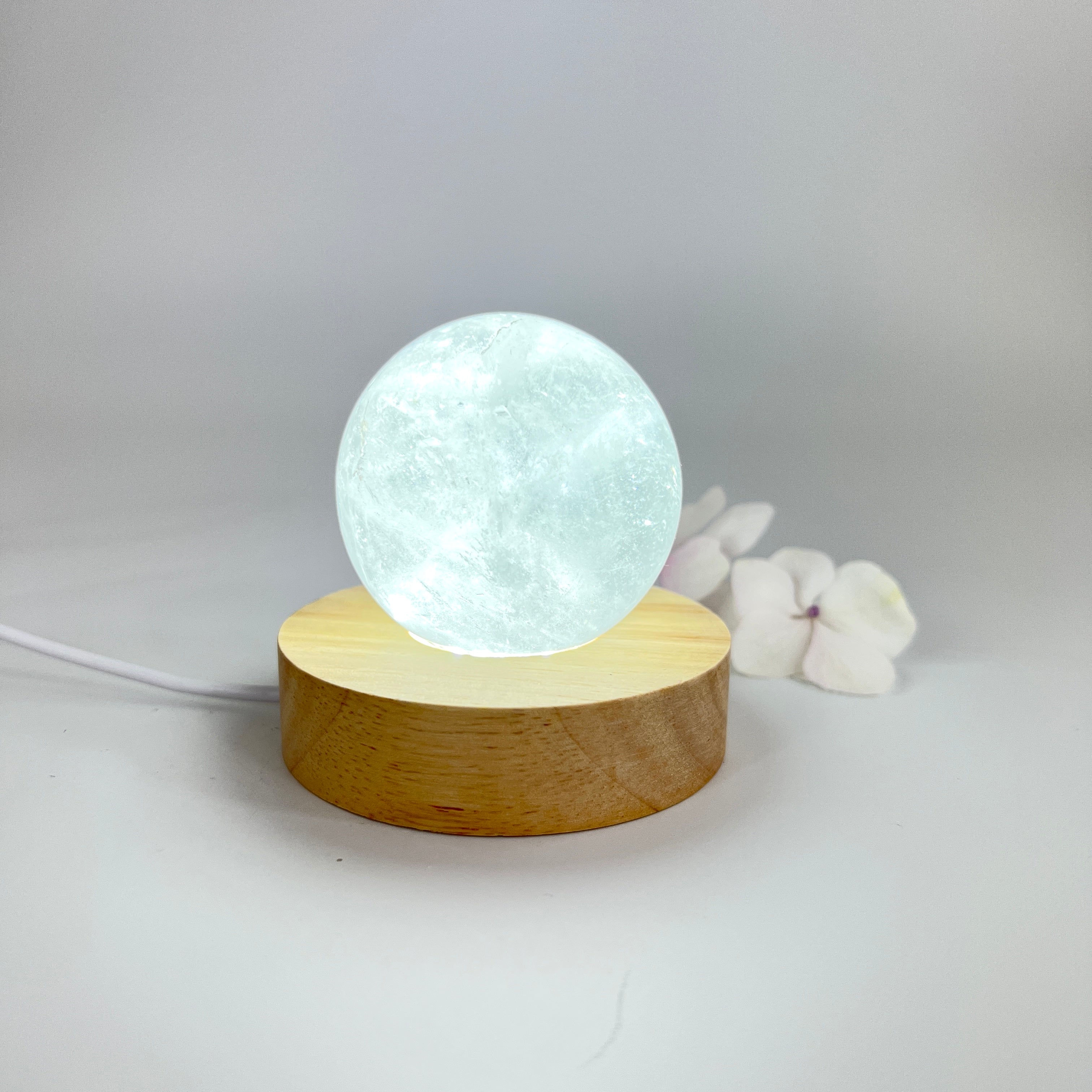 Crystal Lamps NZ: Clear quartz polished crystal sphere on LED lamp base
