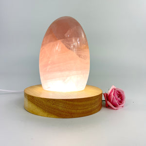 Crystal Lamps NZ: Rose quartz crystal lamp on LED wooden base