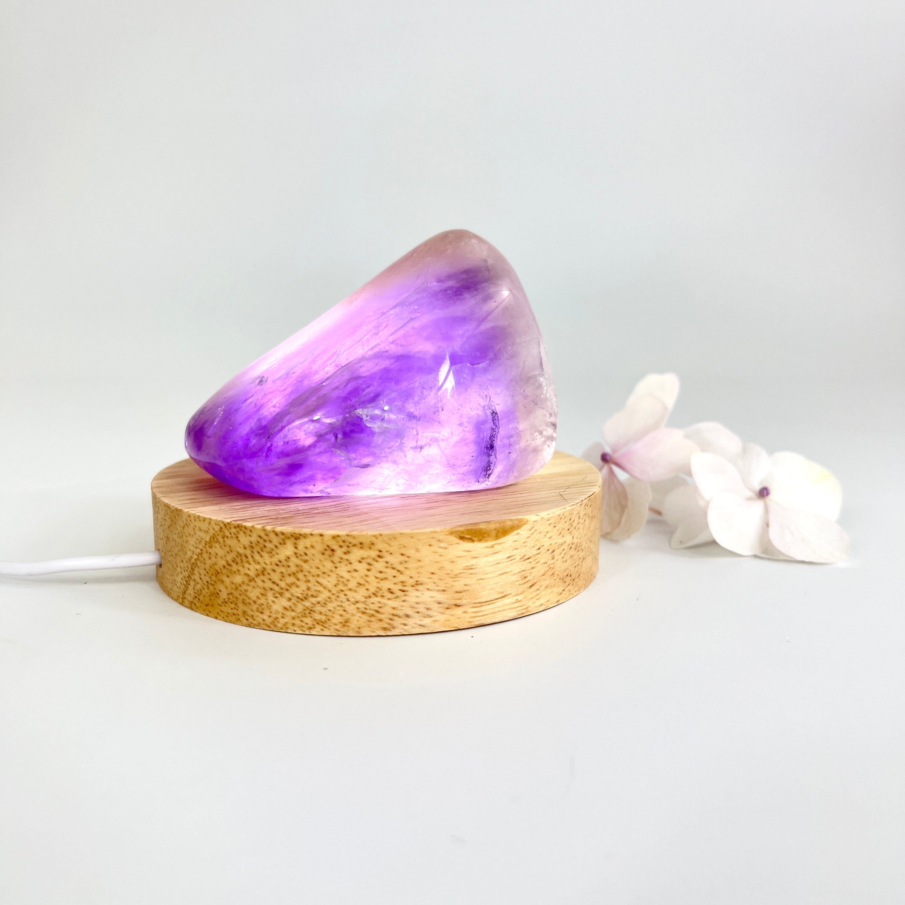 Crystal Lamps NZ: Amethyst crystal lamp on LED wooden base