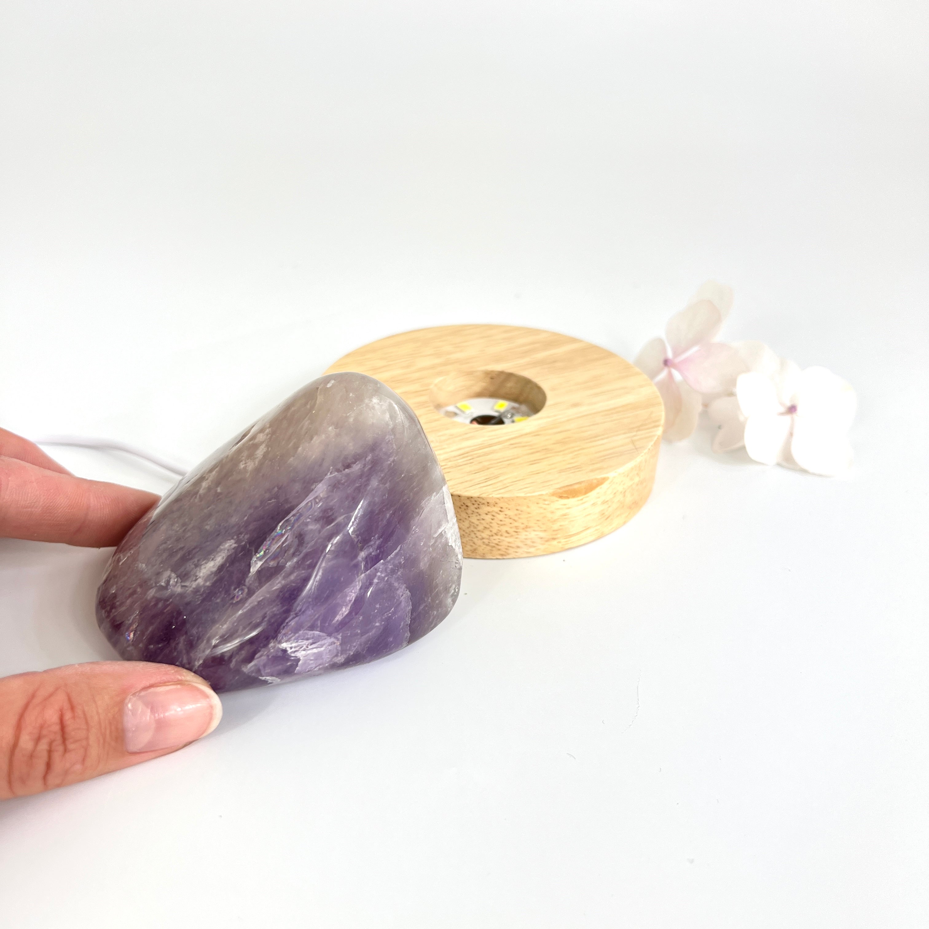 Crystal Lamps NZ: Amethyst crystal lamp on LED wooden base