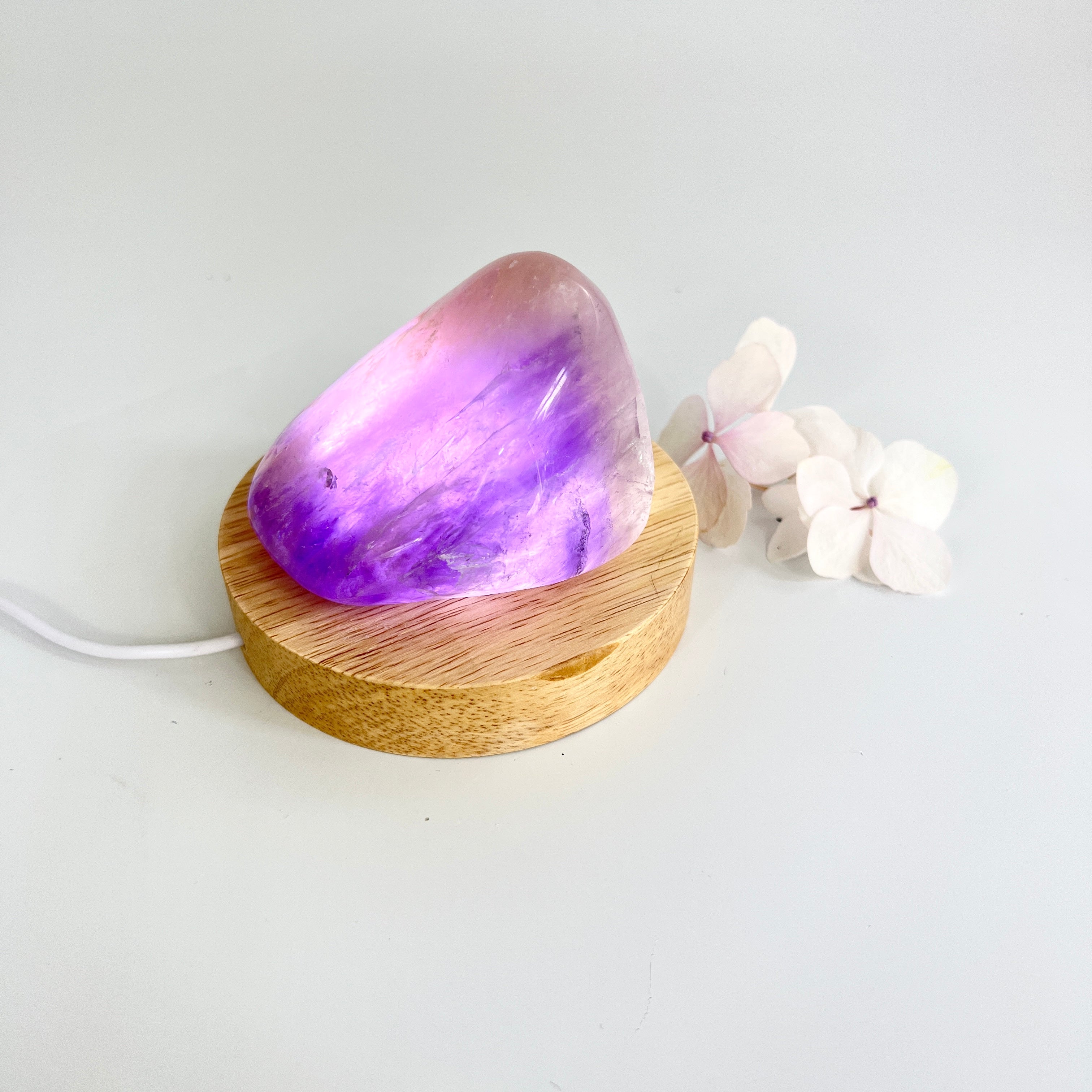 Crystal Lamps NZ: Amethyst crystal lamp on LED wooden base