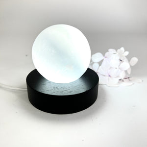 Crystals NZ: Selenite crystal sphere lamp on black LED wooden base
