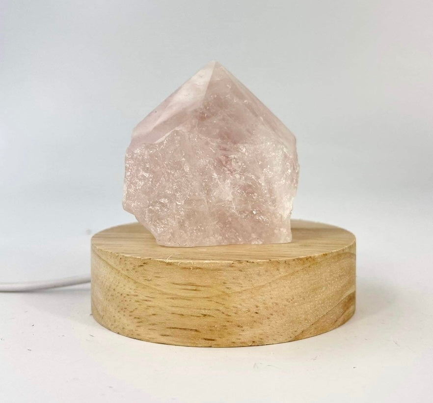 Crystal Lamps NZ: Rose quartz crystal lamp on LED wooden base