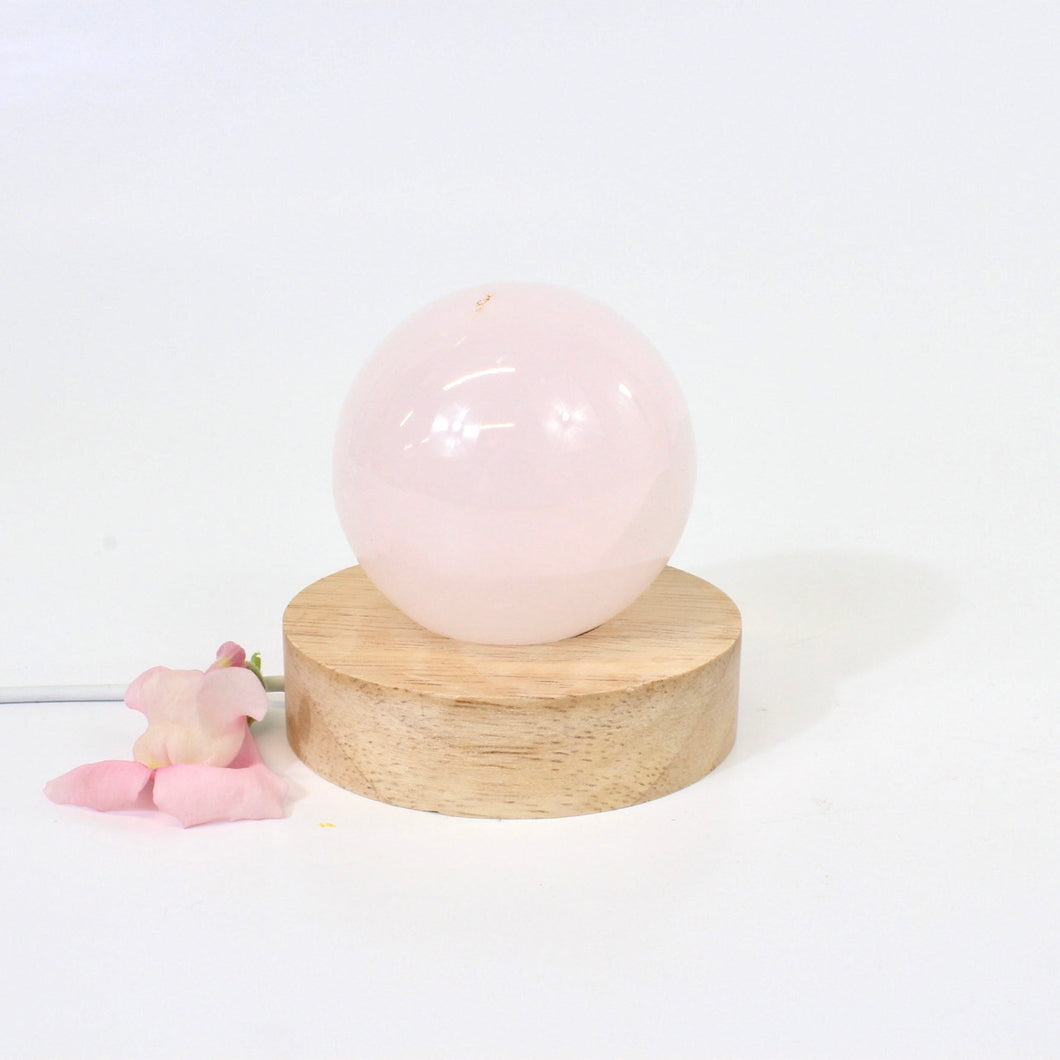 Crystal Lamps NZ: Pink mangano calcite crystal lamp on LED wooden base