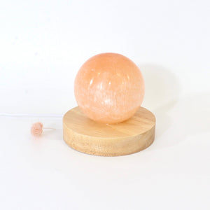 Orange selenite crystal sphere lamp on LED wooden base | ASH&STONE Crystals Shop Auckland NZ