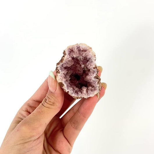 Crystals NZ: Pink amethyst crystal geode half