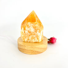 Load image into Gallery viewer, Crystal Lamps NZ: Orange calcite crystal lamp with LED wooden base
