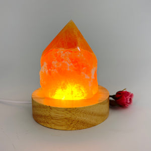 Crystal Lamps NZ: Orange calcite crystal lamp with LED wooden base