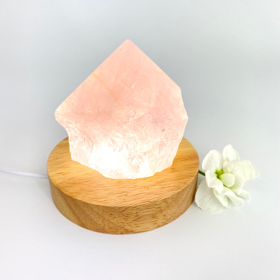 Crystal Lamps NZ: Raw rose quartz crystal lamp on LED wooden base