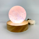 Crystal Lamps NZ: Rose quartz crystal sphere lamp on LED wooden base