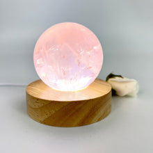 Load image into Gallery viewer, Crystal Lamps NZ: Rose quartz crystal sphere lamp on LED wooden base
