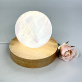 Crystal Lamps NZ: Rose quartz crystal sphere lamp on LED wooden base