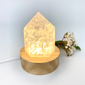 Crystals NZ: Clear quartz crystal point on LED lamp base