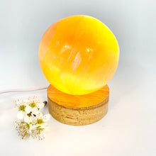 Load image into Gallery viewer, Crystals NZ: Orange selenite crystal sphere on LED lamp base
